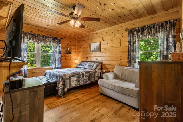 a bed room with a bed and a window