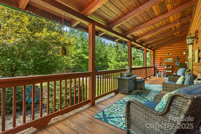 a lobby with furniture and a rug