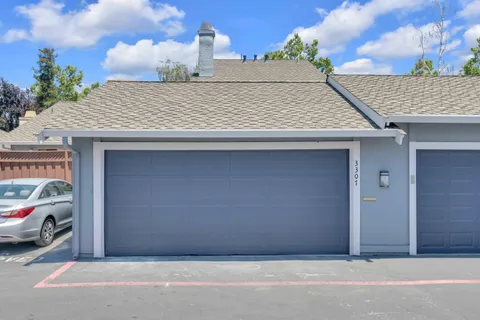 a car parked in front of a house