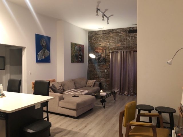 2022 South Throop Street, Unit 1W Chicago, IL 60608 - Photo 5 of 13 a living room with furniture and wooden floor