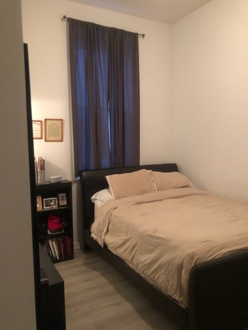 2022 South Throop Street, Unit 1W Chicago, IL 60608 - Photo 9 of 13 a bedroom with a bed and a tv
