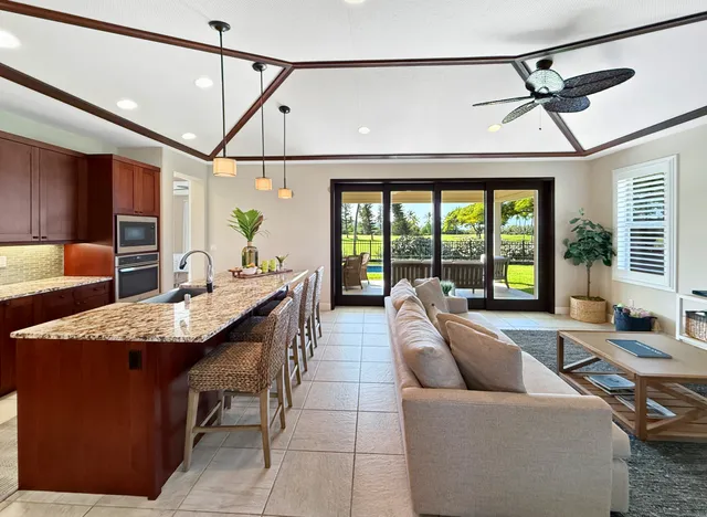 a lobby with furniture and floor to ceiling window