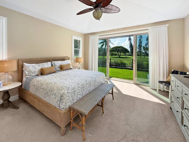 a bedroom with a bed and a table