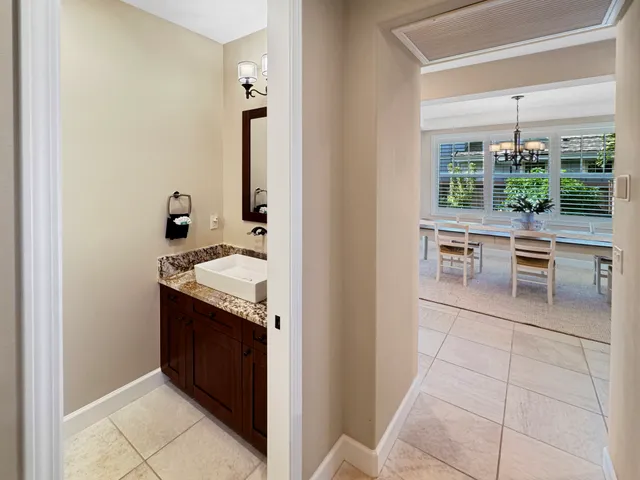 a kitchen with stainless steel appliances granite countertop a sink and a refrigerator