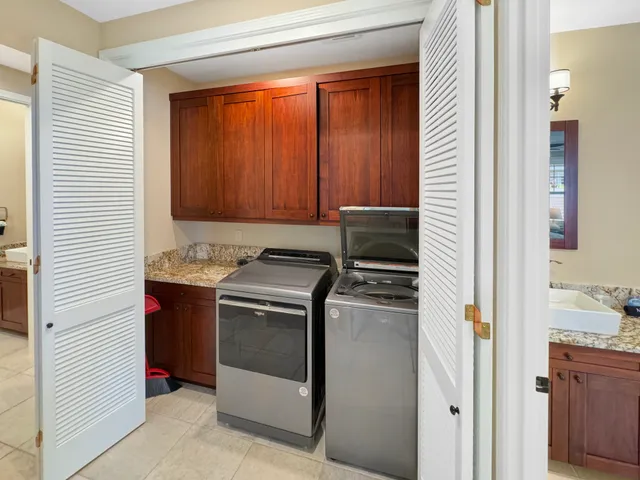 a kitchen with a stove and a refrigerator