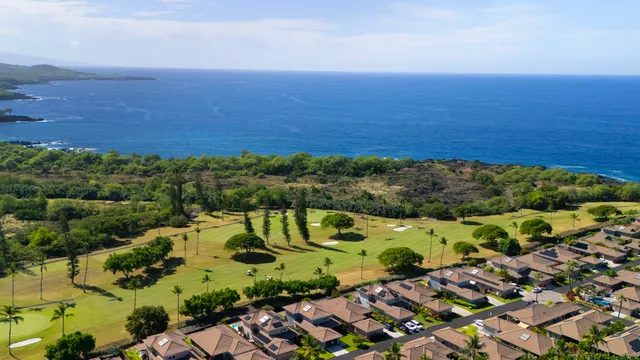 an aerial view of ocean with residential house with outdoor space