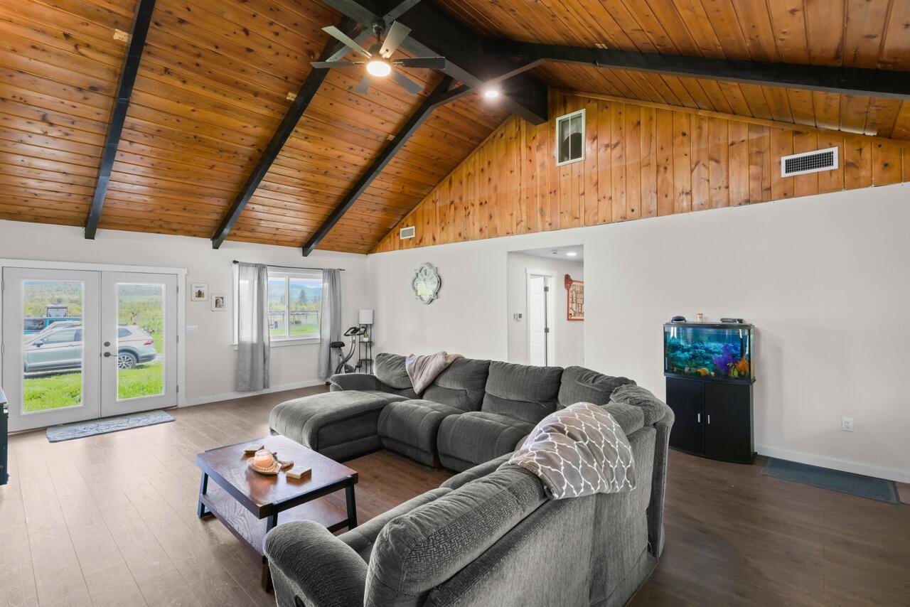 380 Greenleaf Drive Eagle Point, OR 97524 - Photo 11 of 31 a living room with furniture and a wooden floor