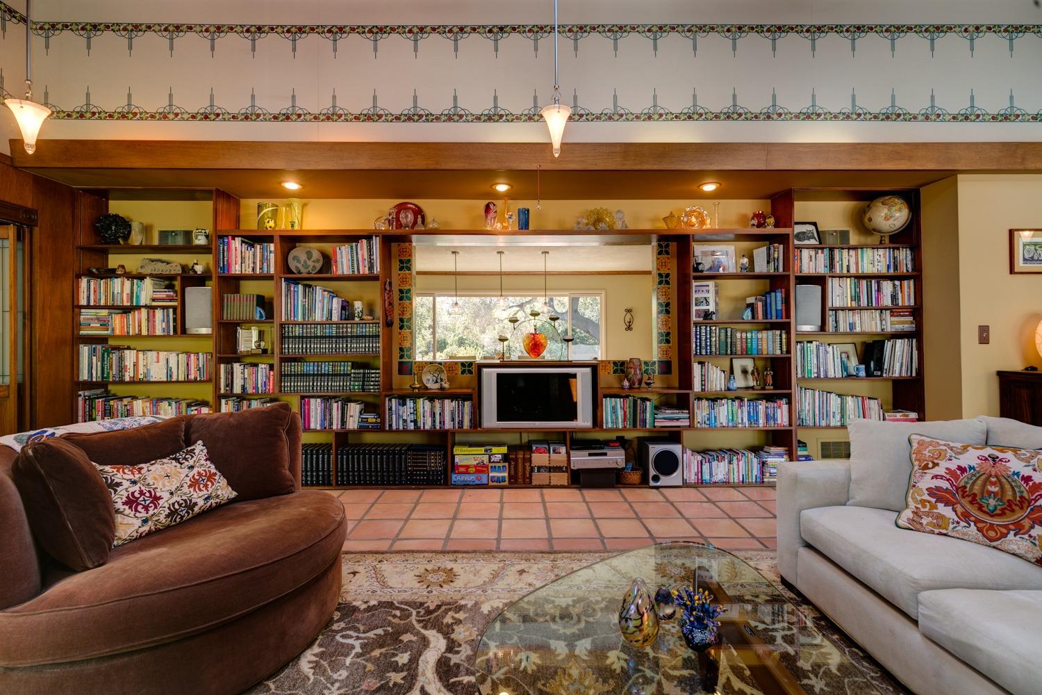 918 El Toro Road Ojai, CA 93023 - Photo 11 of 43 a living room with furniture a rug and a flat screen tv