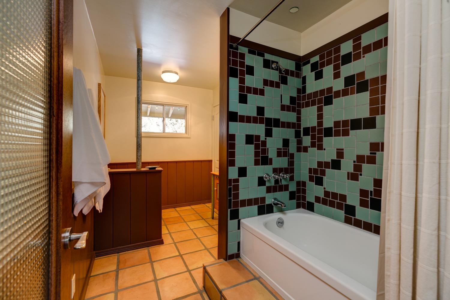918 El Toro Road Ojai, CA 93023 - Photo 15 of 43 a bathroom with a bathtub a sink and a shower