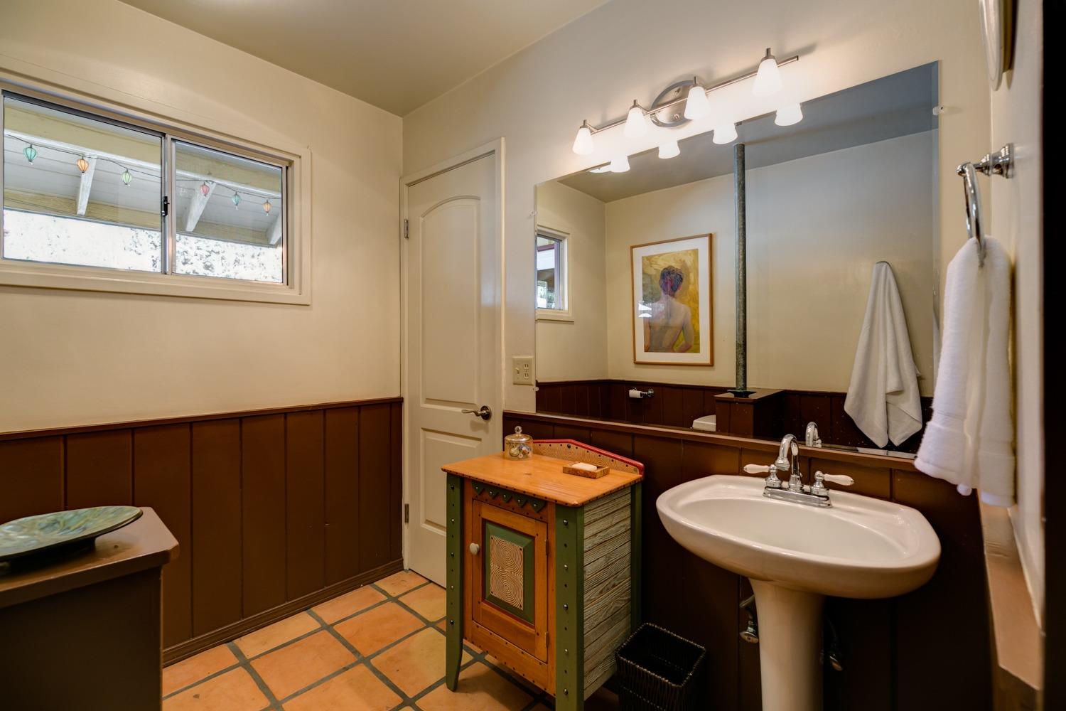 918 El Toro Road Ojai, CA 93023 - Photo 16 of 43 a bathroom with a sink and a mirror