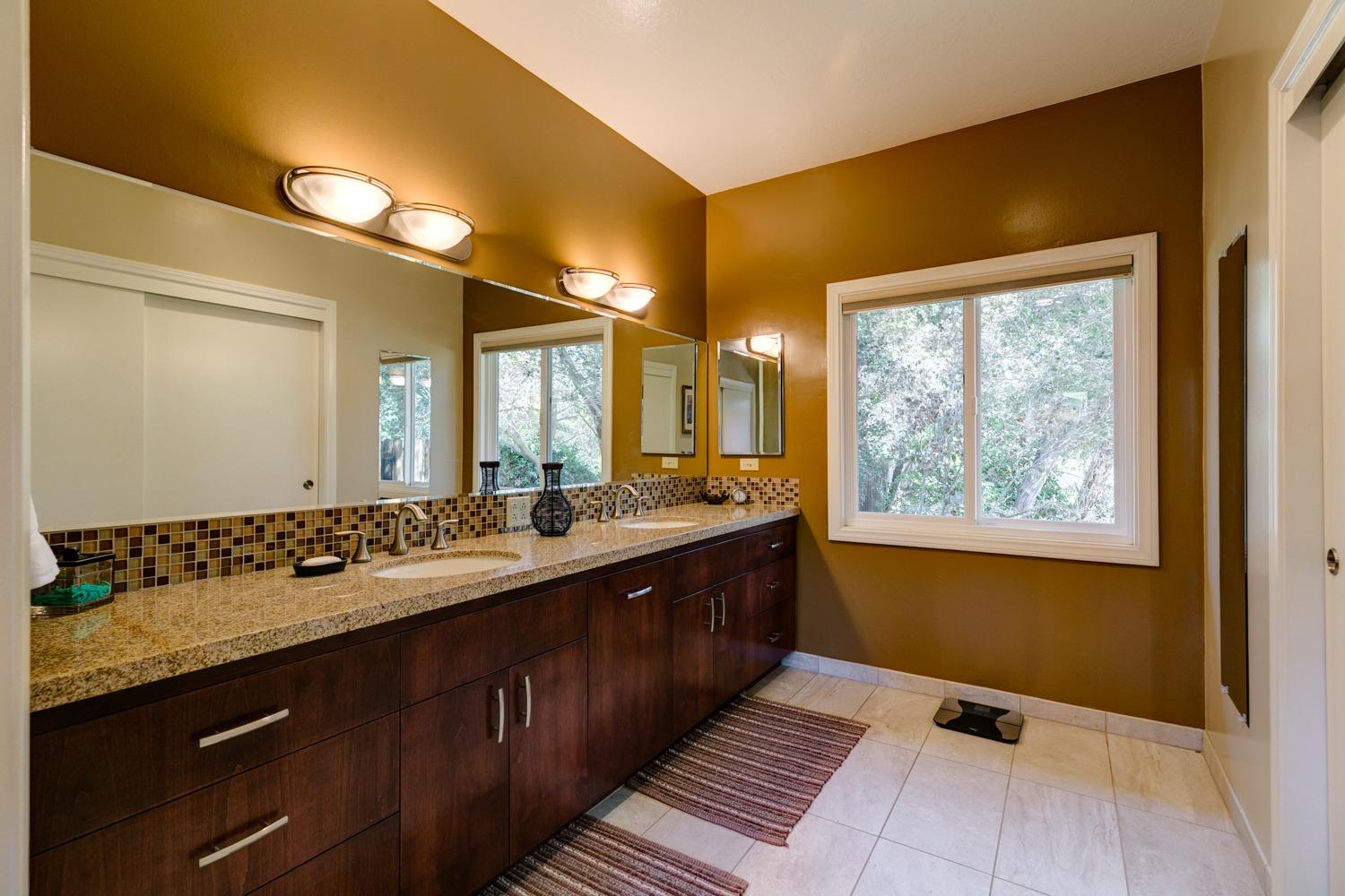 918 El Toro Road Ojai, CA 93023 - Photo 19 of 43 a bathroom with a double vanity sink and a mirror