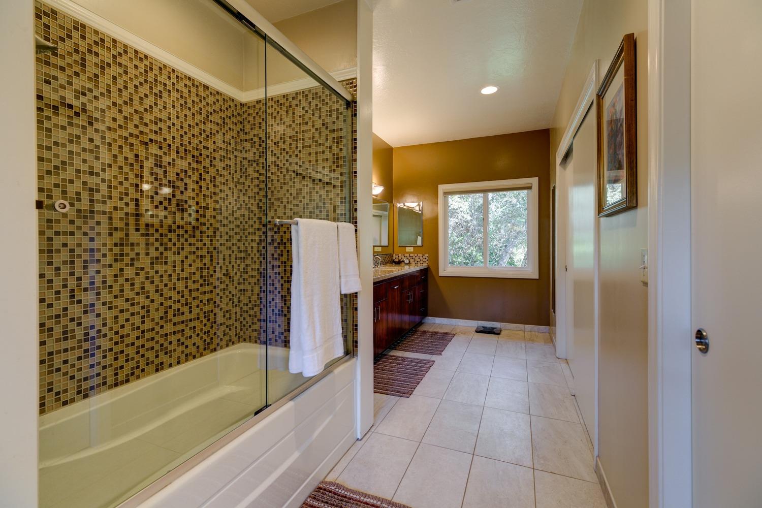 918 El Toro Road Ojai, CA 93023 - Photo 21 of 43 a bathroom with a bathtub and a shower