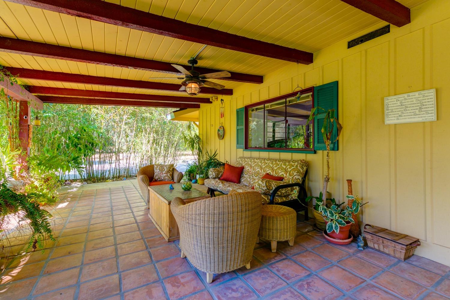 918 El Toro Road Ojai, CA 93023 - Photo 27 of 43 a living room with couch and a potted plant