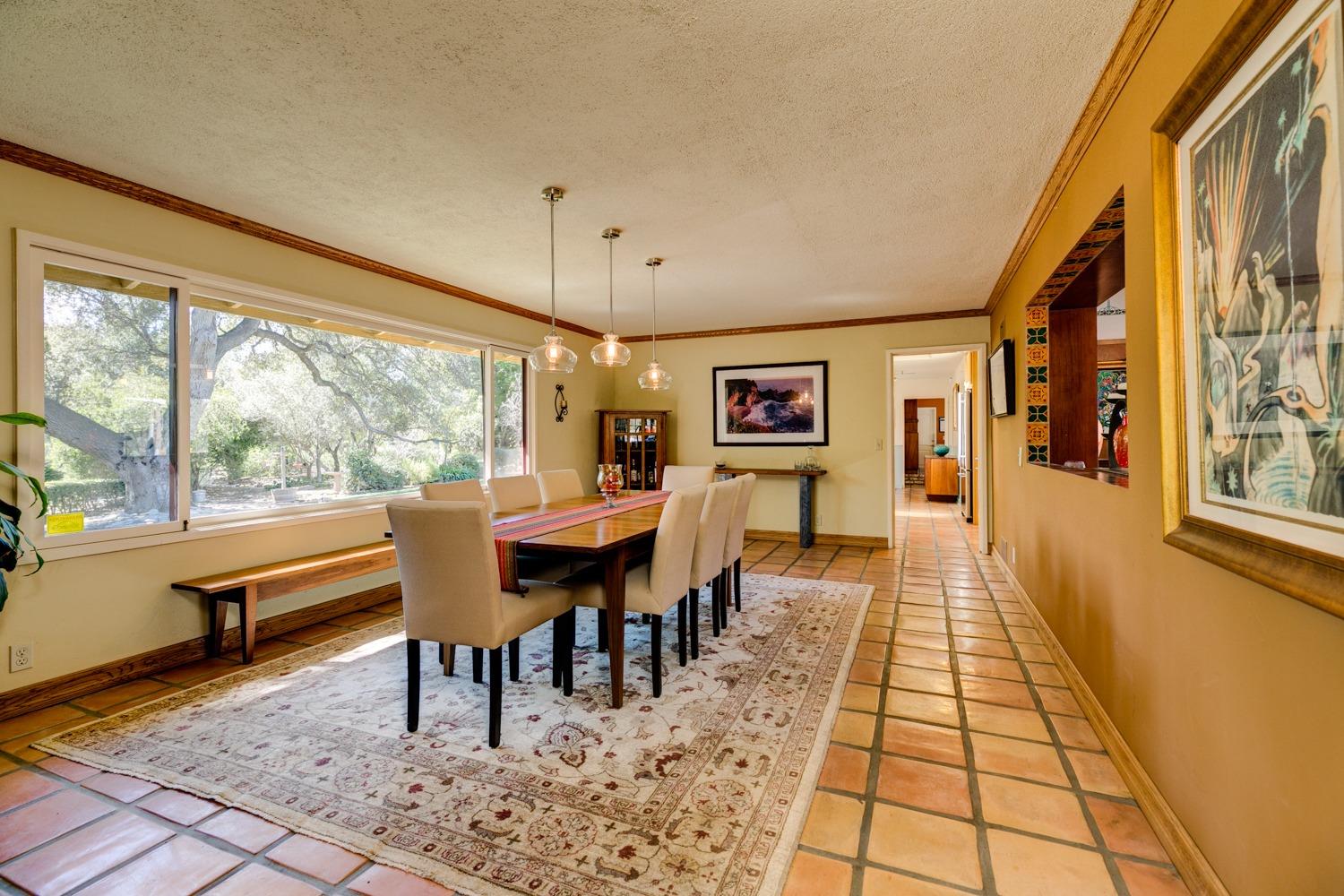 918 El Toro Road Ojai, CA 93023 - Photo 3 of 43 a dining room with a table chairs and a rug