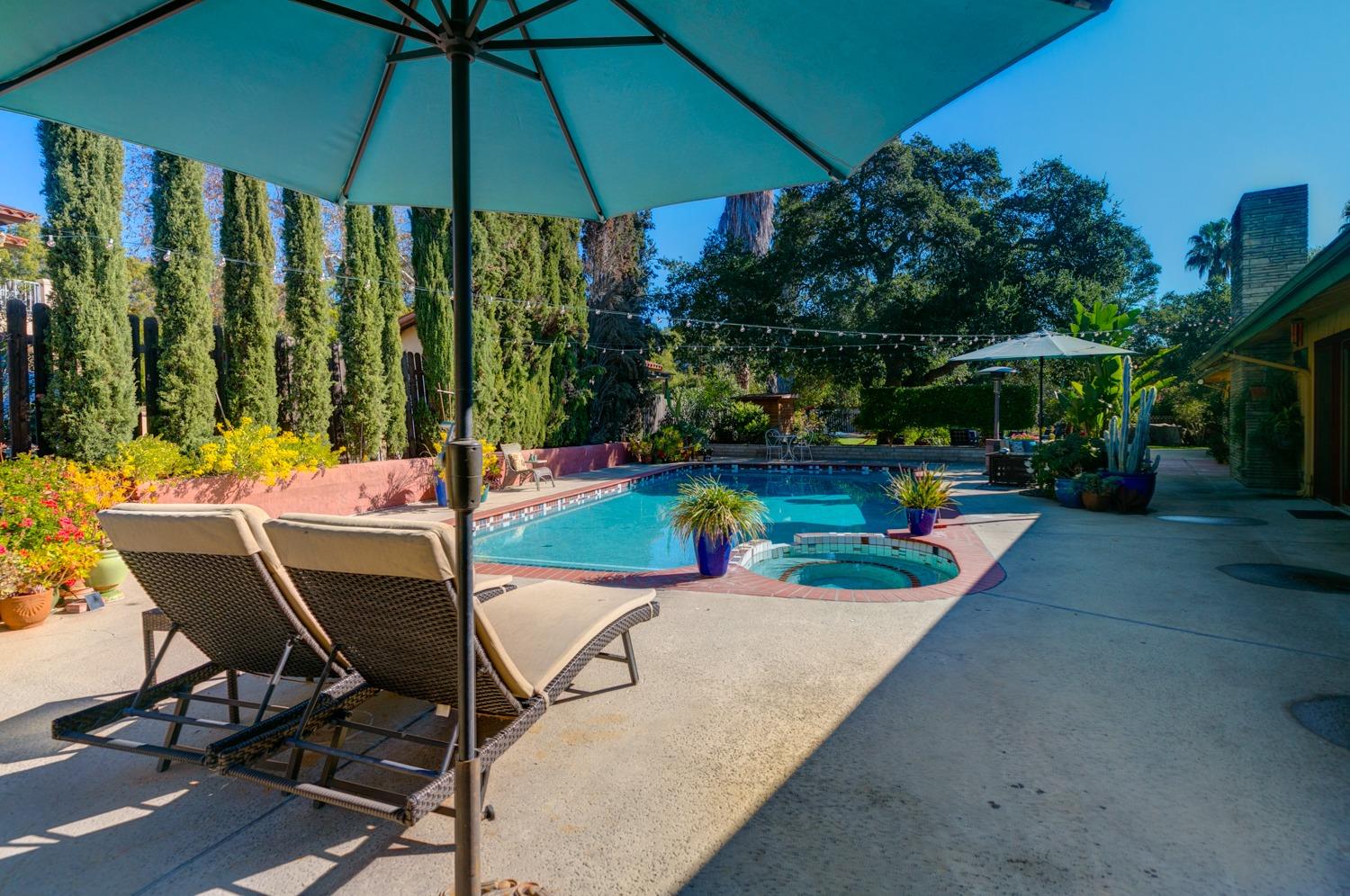 918 El Toro Road Ojai, CA 93023 - Photo 31 of 43 a view of a table and chairs under an umbrella