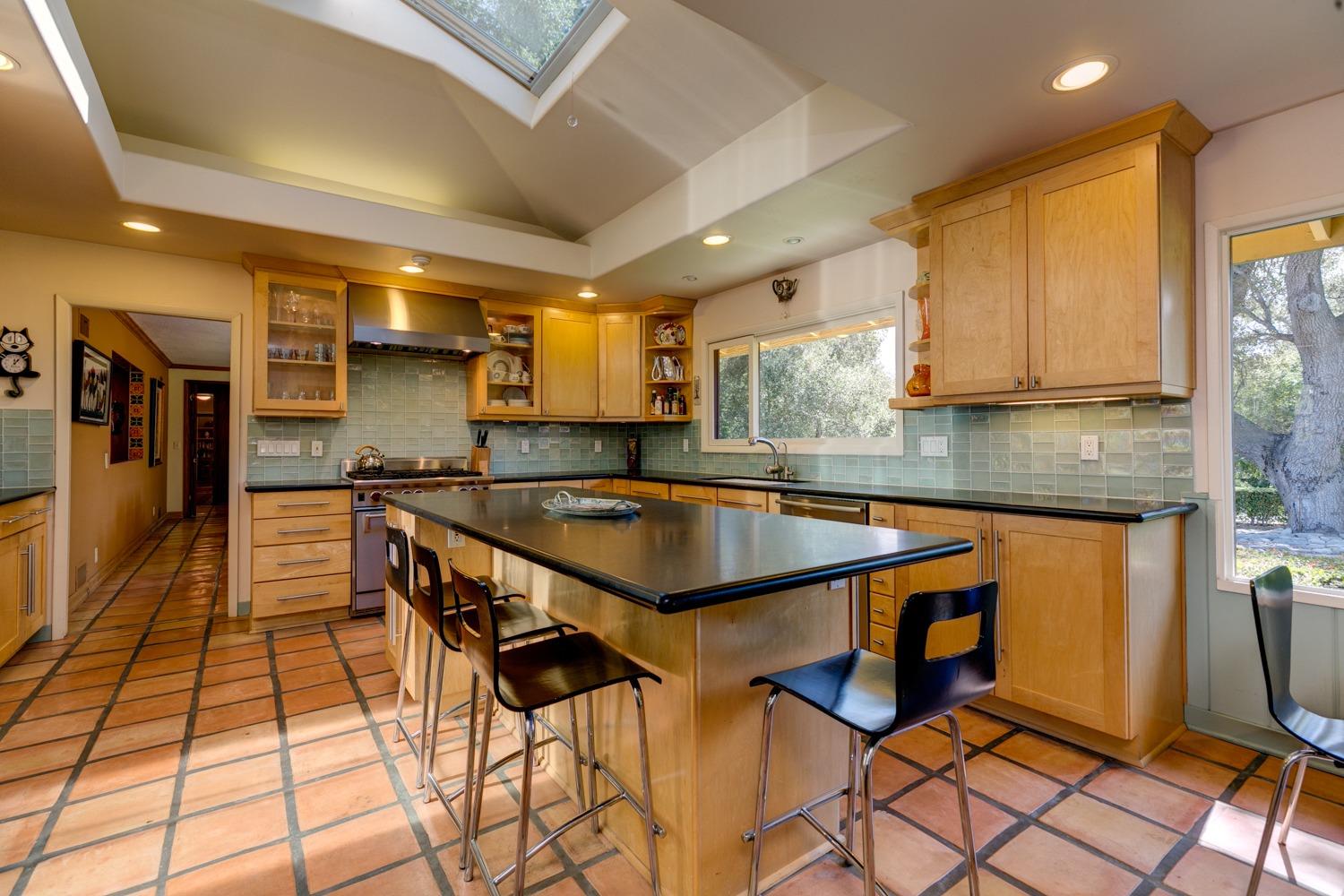 918 El Toro Road Ojai, CA 93023 - Photo 7 of 43 a kitchen with stainless steel appliances granite countertop a stove a sink and a refrigerator