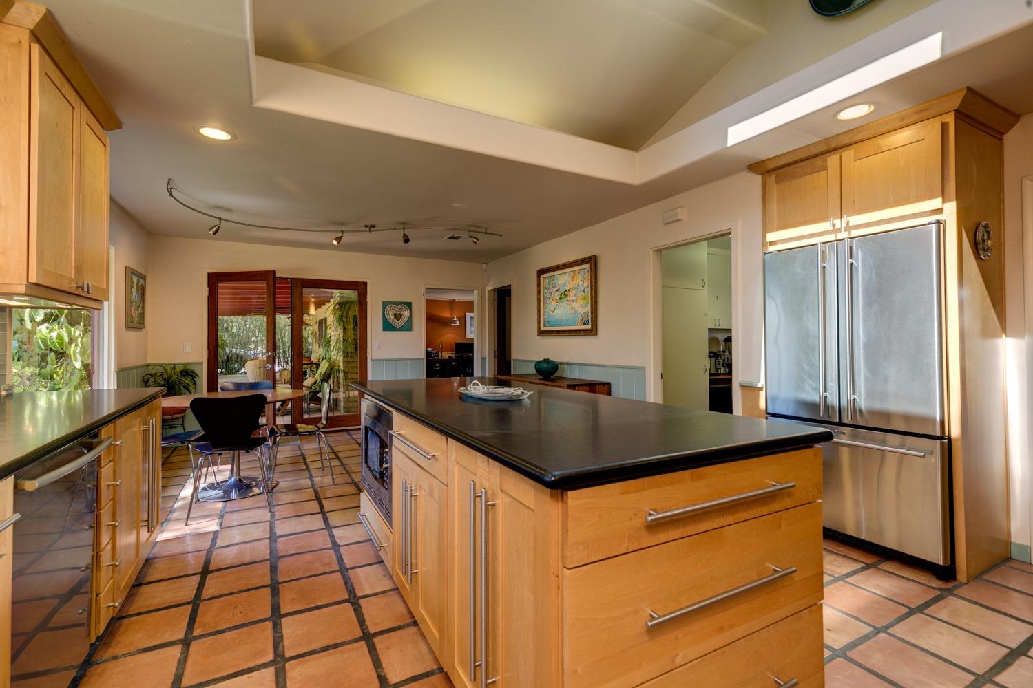 918 El Toro Road Ojai, CA 93023 - Photo 8 of 43 a kitchen with a sink and large refrigerator