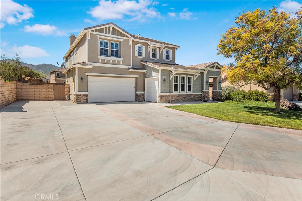 16189 Devor Circle Riverside, CA 92503 - Photo 1 of 1 a front view of a house with a yard and garage