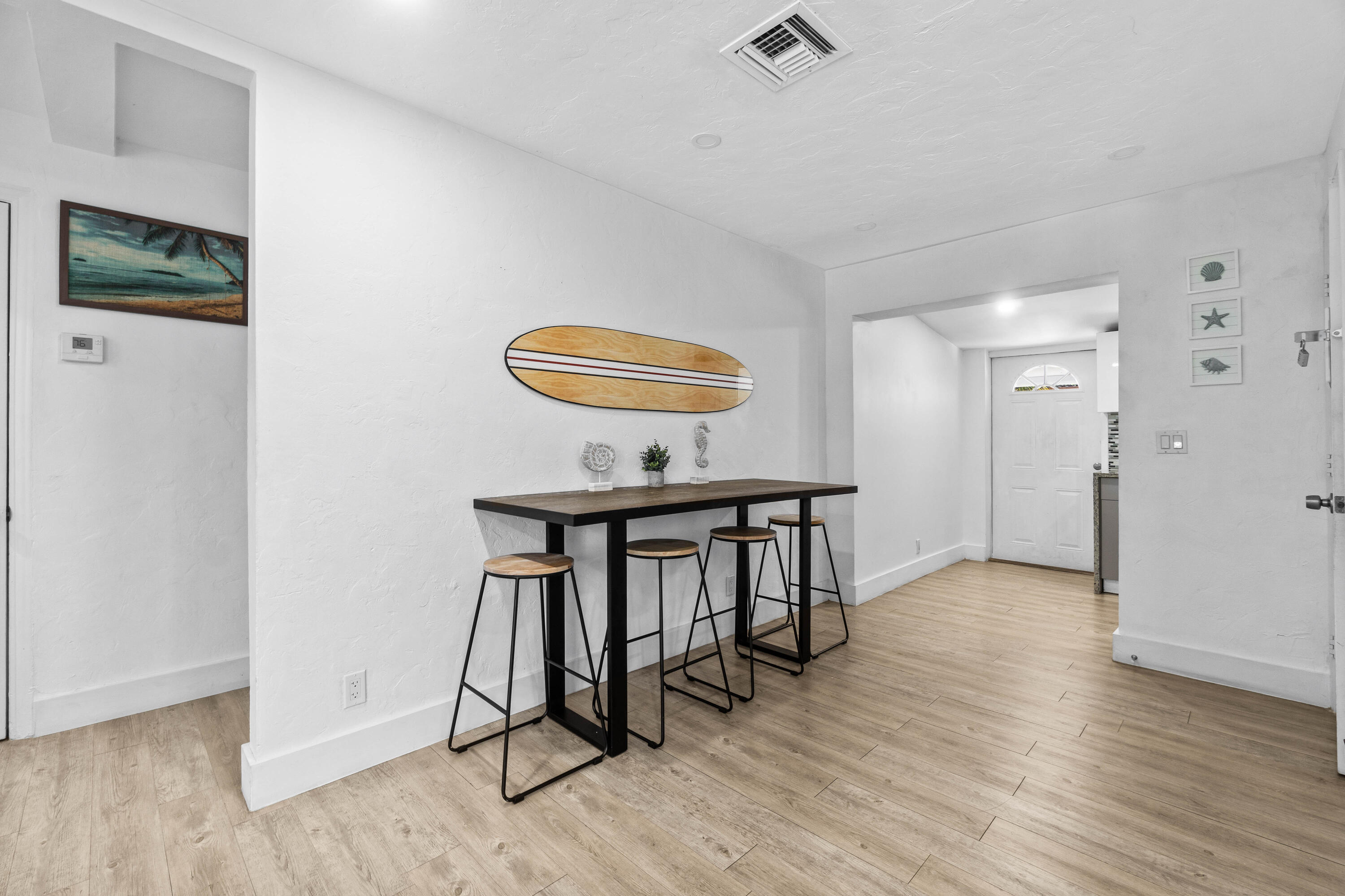 814 Franklin Road West Palm Beach, FL 33405 - Photo 4 of 12 a view of a hallway with wooden floor and furniture