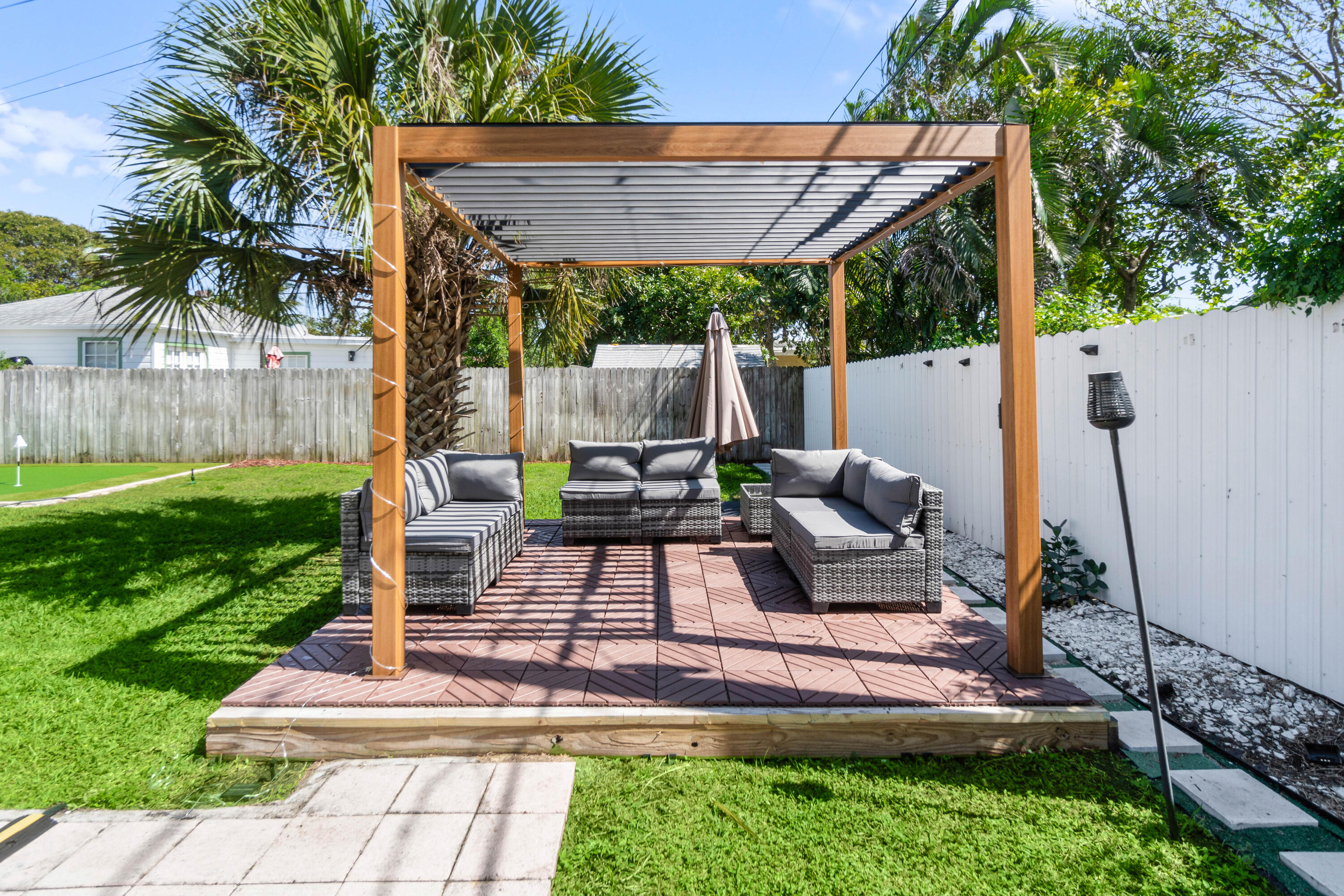 814 Franklin Road West Palm Beach, FL 33405 - Photo 10 of 12 a view of a backyard with couches chair and a fire pit