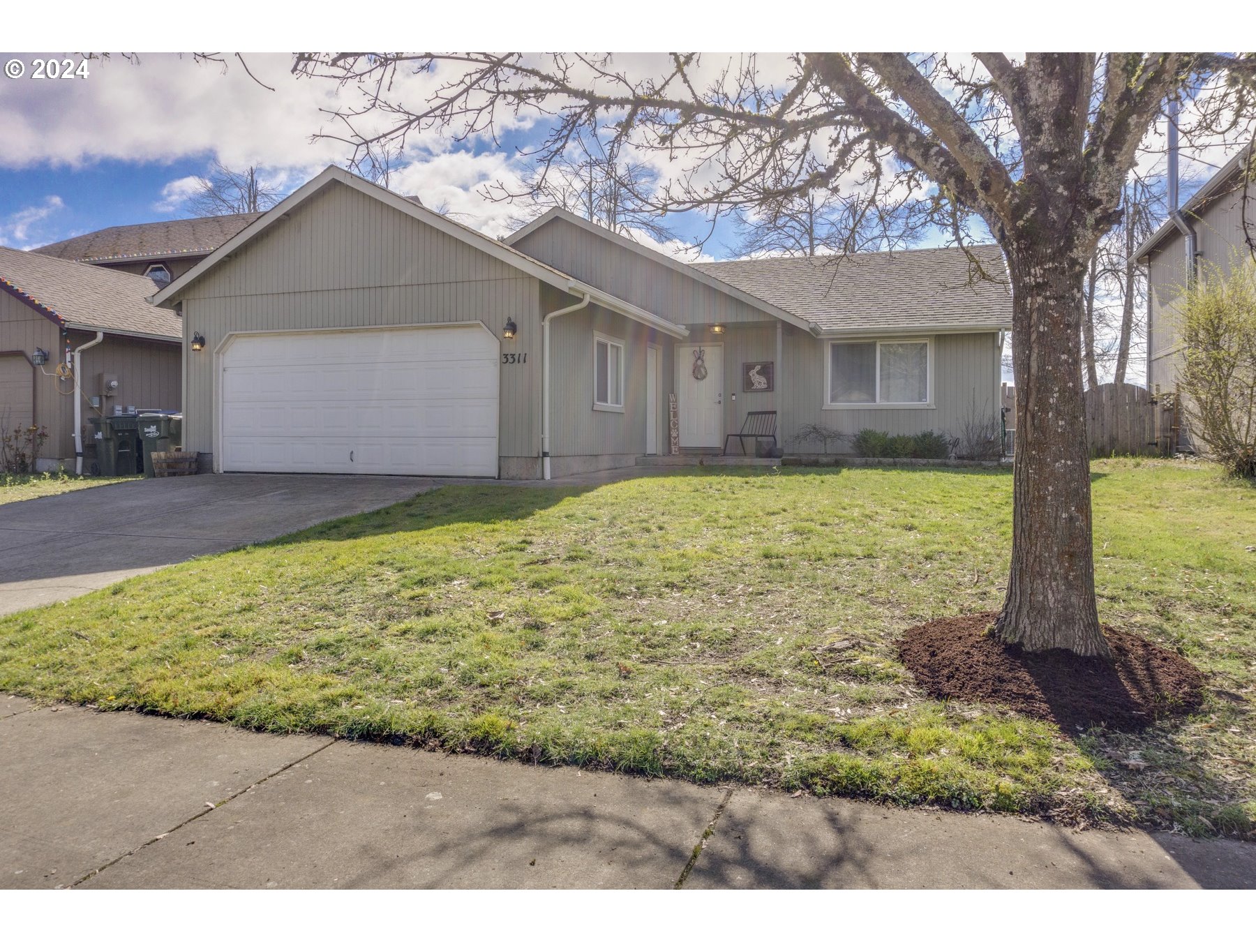 3311 Pinyon Street Springfield, OR 97478 - Photo 2 of 21 a view of a house with a yard