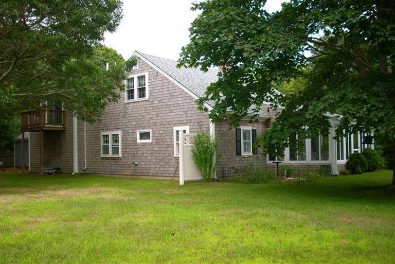 67 Joyce Anne Road Centerville, MA 02632 - Photo 5 of 32 front view of a house with a yard