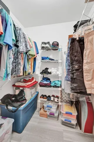 a room with gym equipment and large mirror