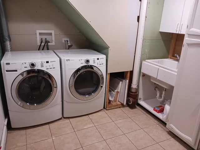 a utility room with dryer and washer