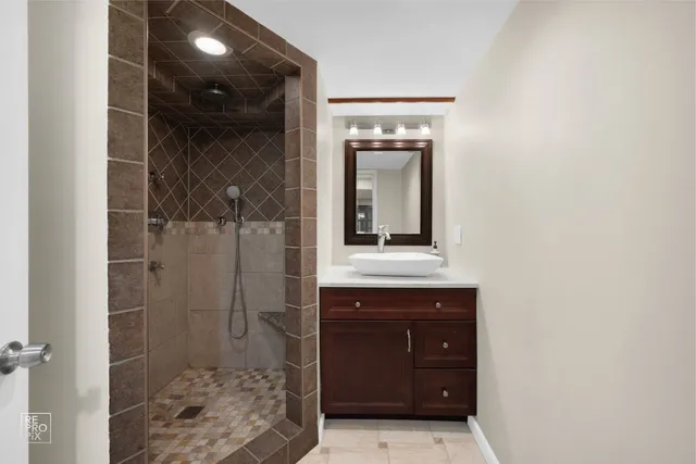 a bathroom with a sink and mirror