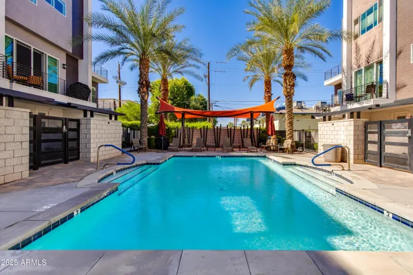 a view of a swimming pool with a patio