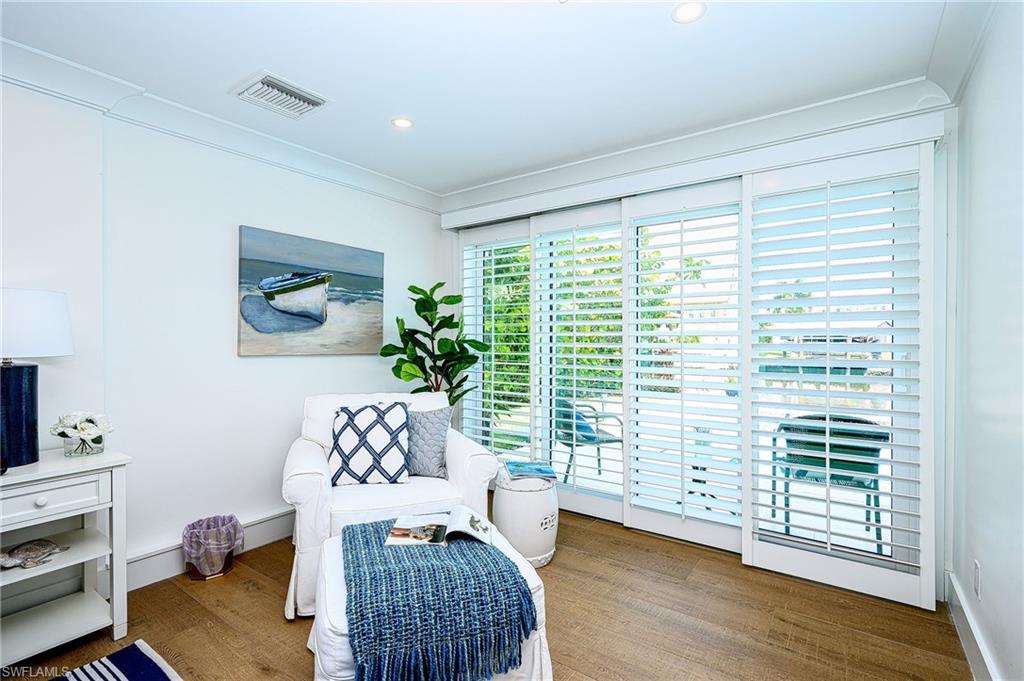 343 Conners Avenue Naples, FL 34108 - Photo 22 of 34 a room with furniture and a window