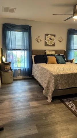 a bedroom with a bed and window