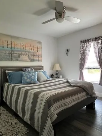 a bedroom with a bed and window