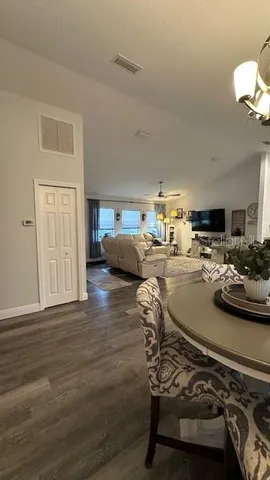 a room with furniture and a wooden floor