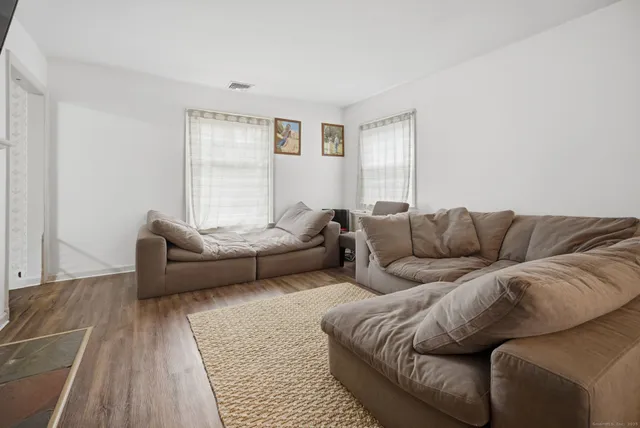a living room with furniture and a couch