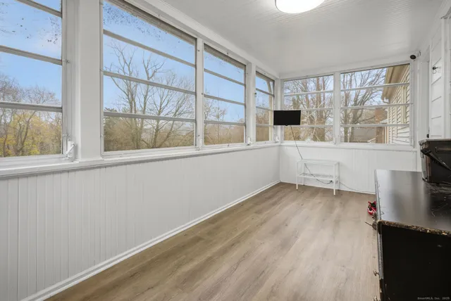 a view of an empty room with a window