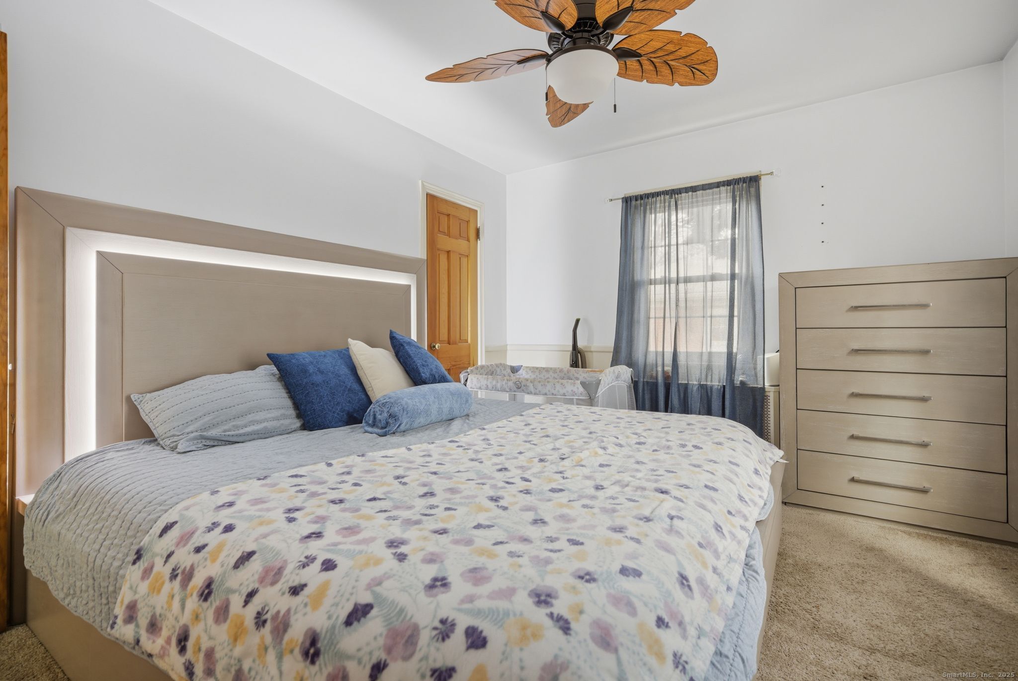 23 Baldwin Street Meriden, CT 06451 - Photo 19 of 40 a bedroom with a bed and cabinet