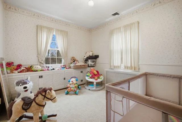a playing room with toys and a window