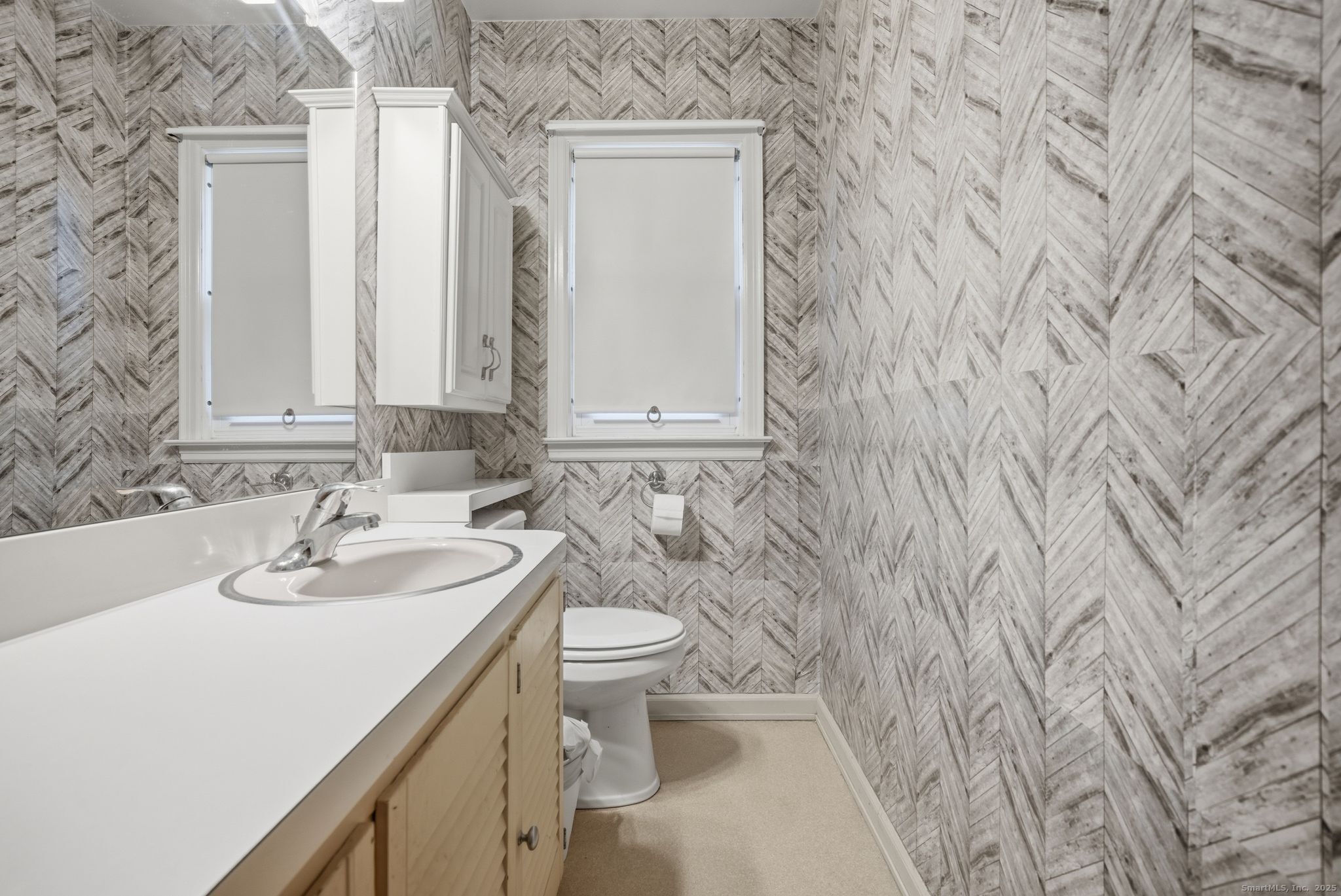 23 Baldwin Street Meriden, CT 06451 - Photo 22 of 40 a bathroom with a sink and a toilet