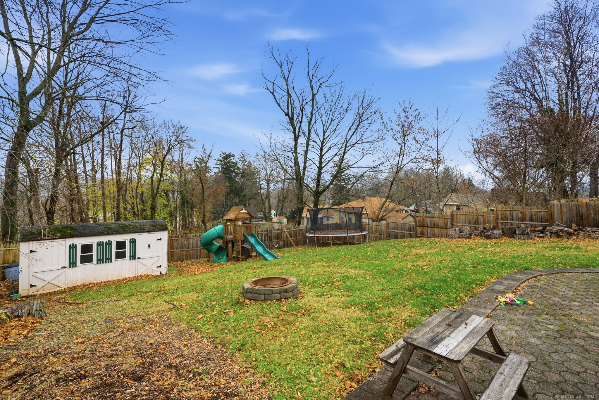 23 Baldwin Street Meriden, CT 06451 - Photo 36 of 40 a view of a house with a yard patio and fire pit