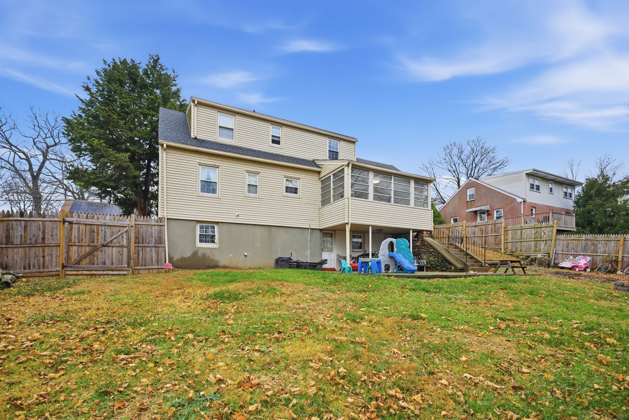 23 Baldwin Street Meriden, CT 06451 - Photo 39 of 40 a view of a house with a big yard and large trees