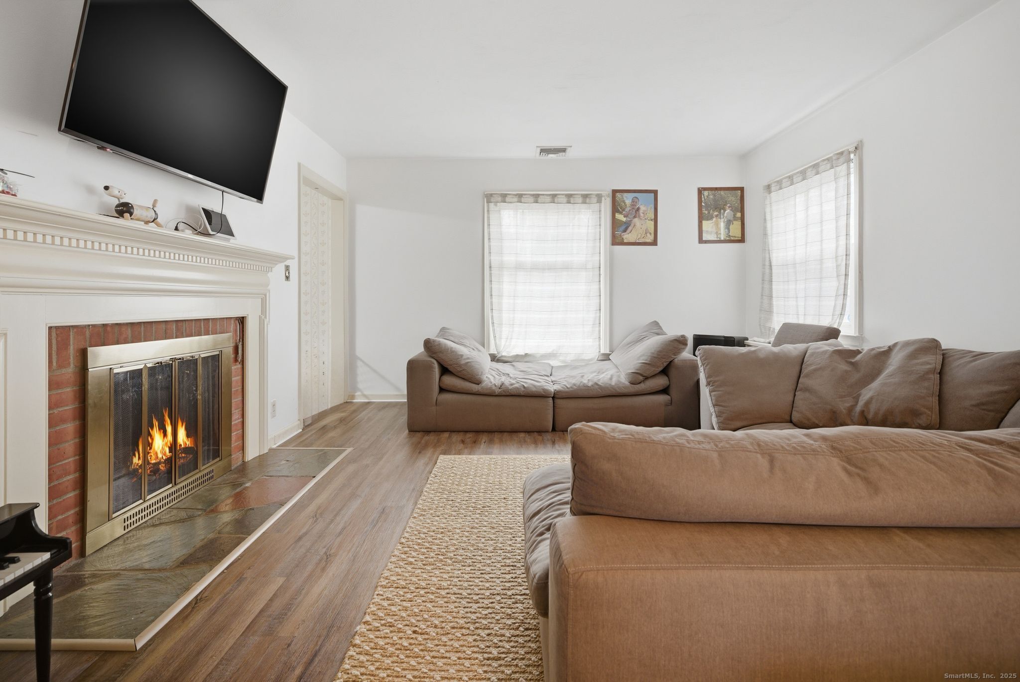 23 Baldwin Street Meriden, CT 06451 - Photo 7 of 40 a living room with furniture and a flat screen tv