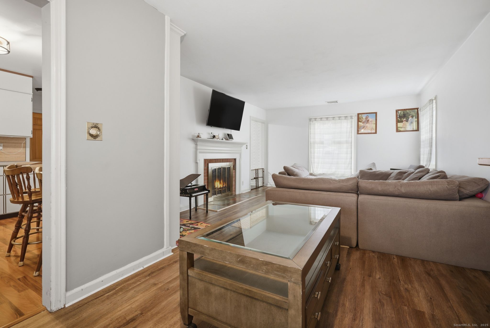 23 Baldwin Street Meriden, CT 06451 - Photo 8 of 40 a living room with furniture and a flat screen tv