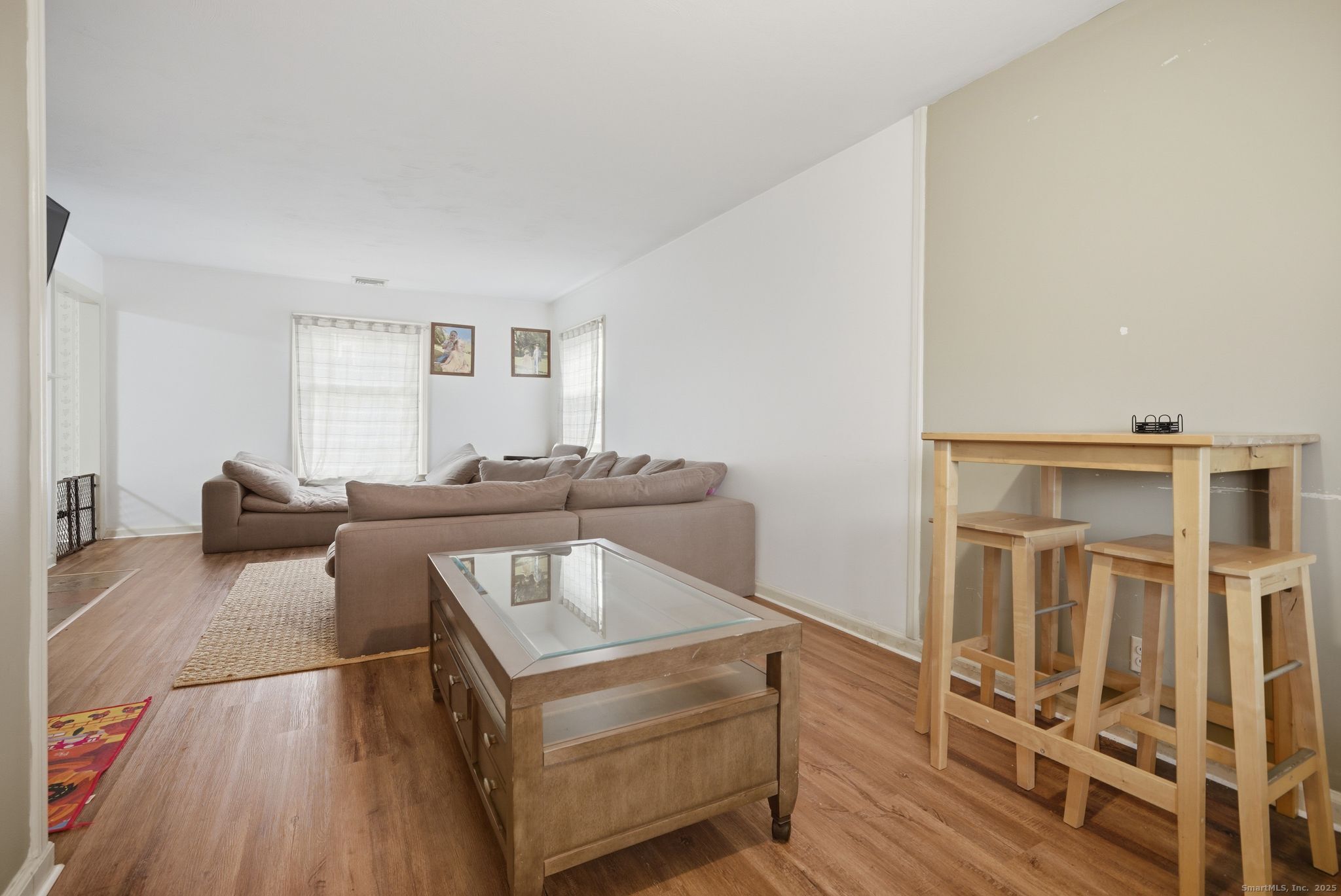23 Baldwin Street Meriden, CT 06451 - Photo 9 of 40 a living room with furniture and a wooden floor