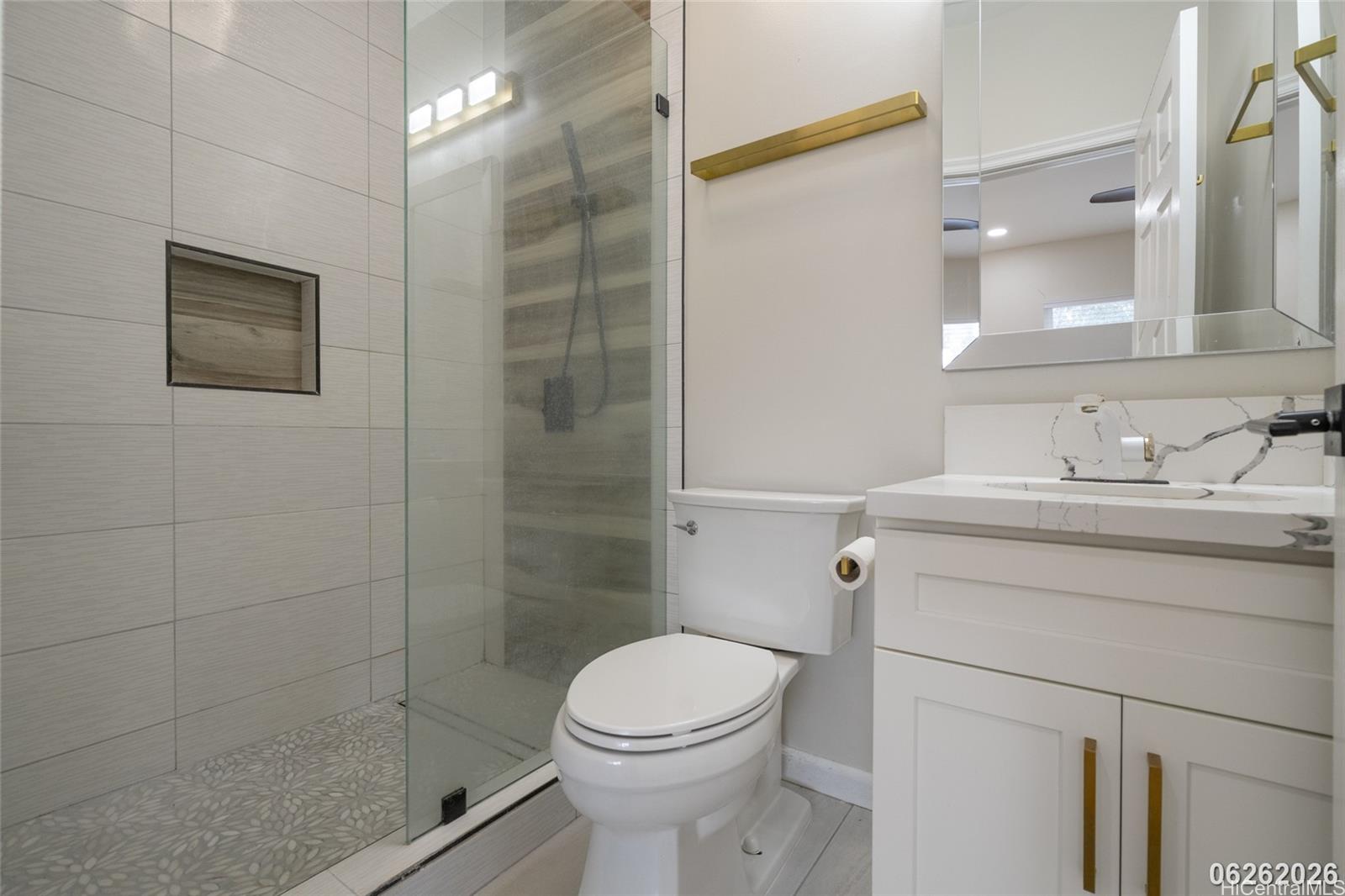 87-1409 Akowai Road Waianae, HI 96792 - Photo 18 of 25 a bathroom with a sink toilet and shower