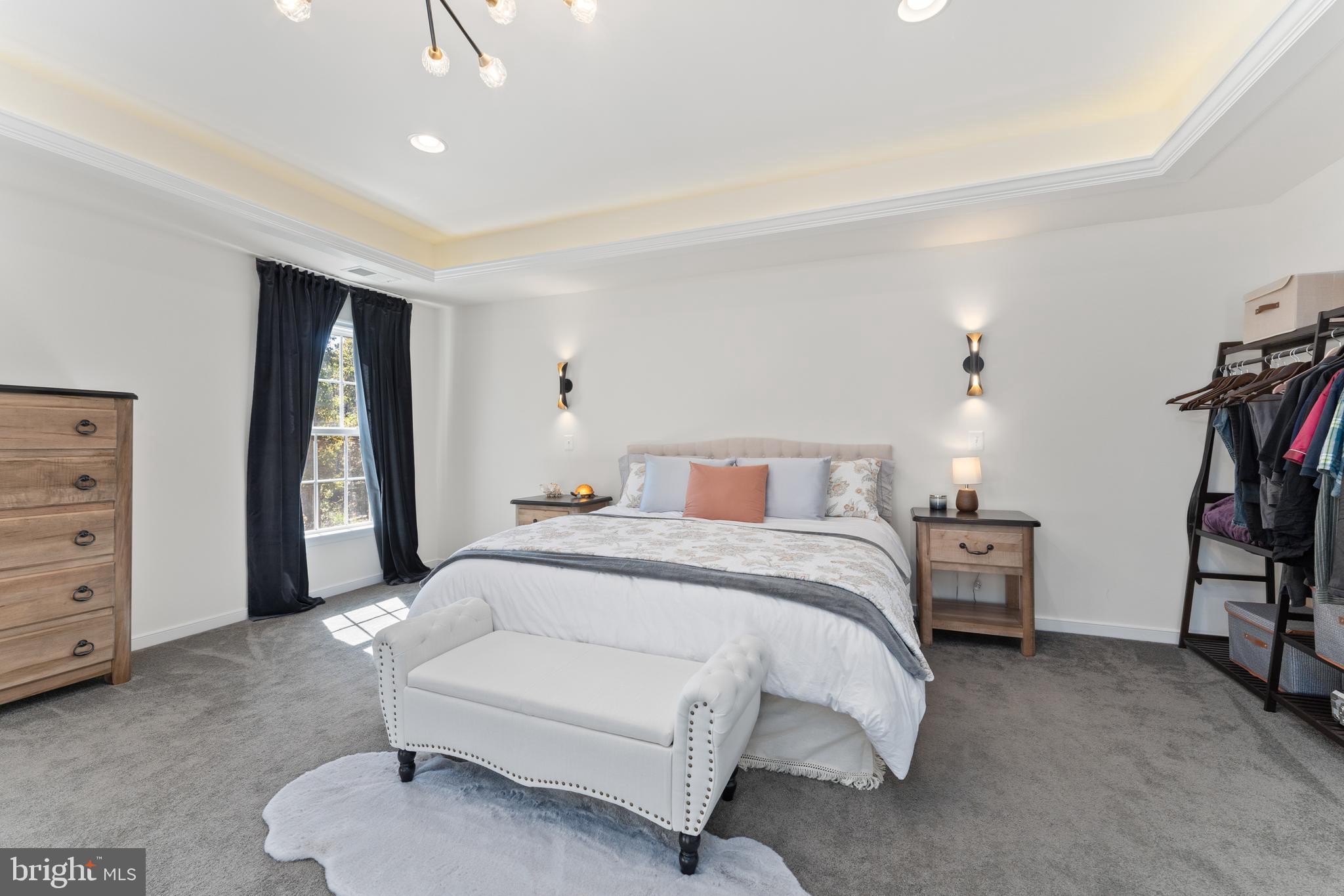 80 Shackelford Well Road Fredericksburg, VA 22406 - Photo 39 of 108 a spacious bedroom with a bed a dresser and book shelf