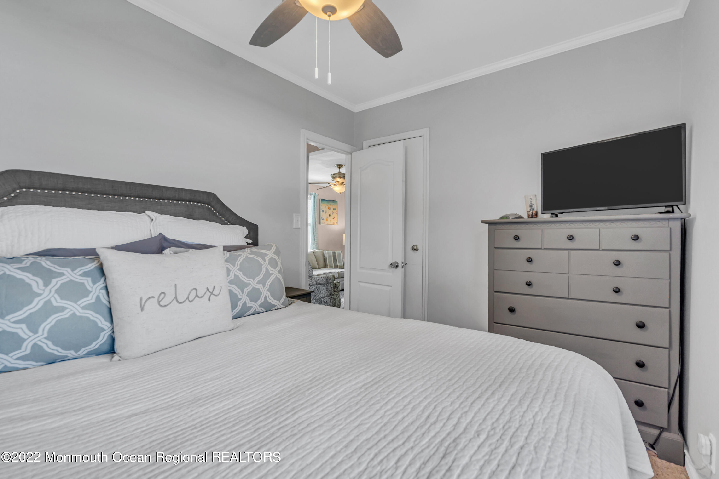 1310 Squirrel Road Wall, NJ 07719 - Photo 14 of 28 a bedroom with a large bed and a flat screen tv