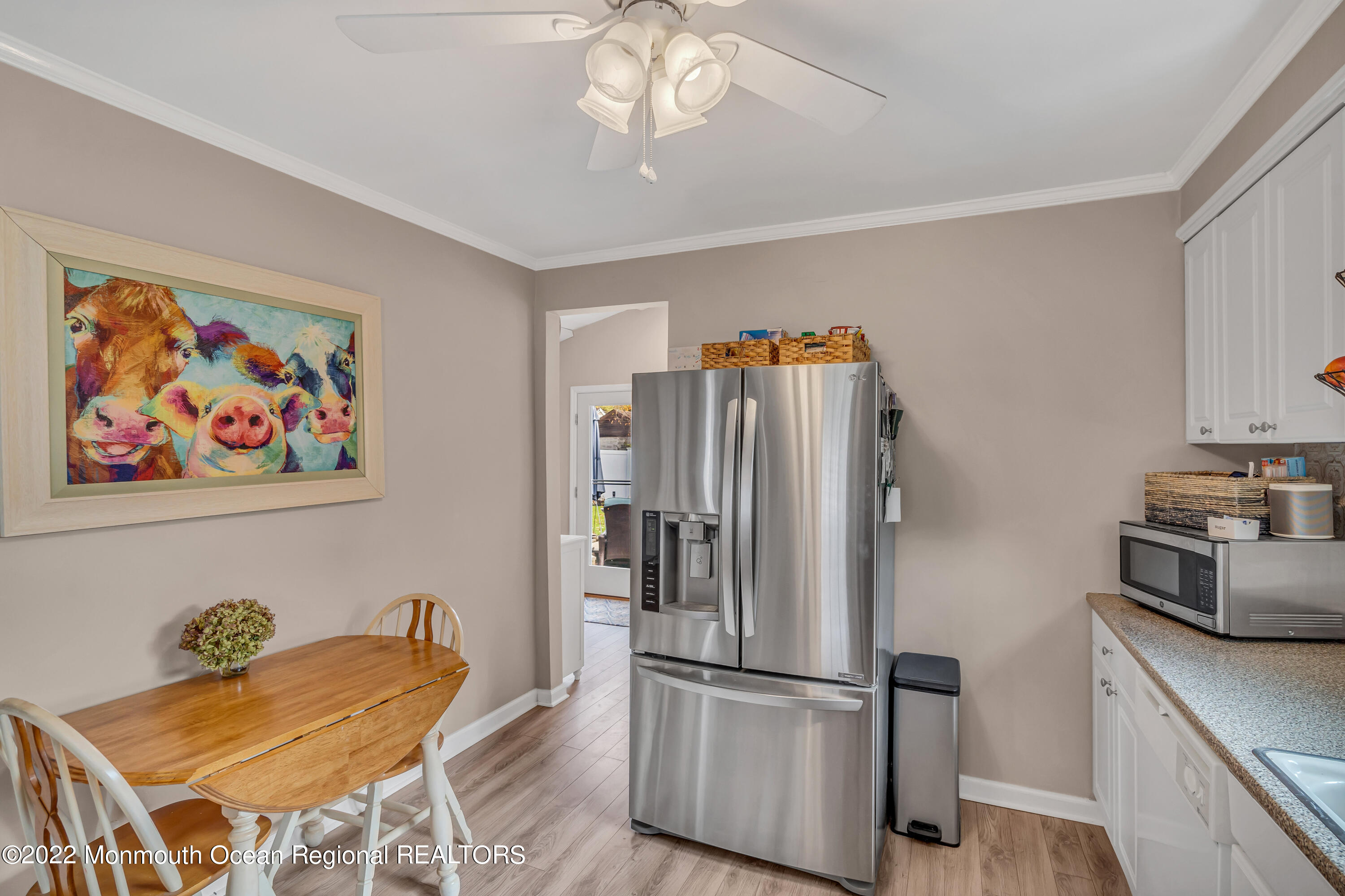 1310 Squirrel Road Wall, NJ 07719 - Photo 10 of 28 a kitchen with stainless steel appliances granite countertop a refrigerator and a stove top oven