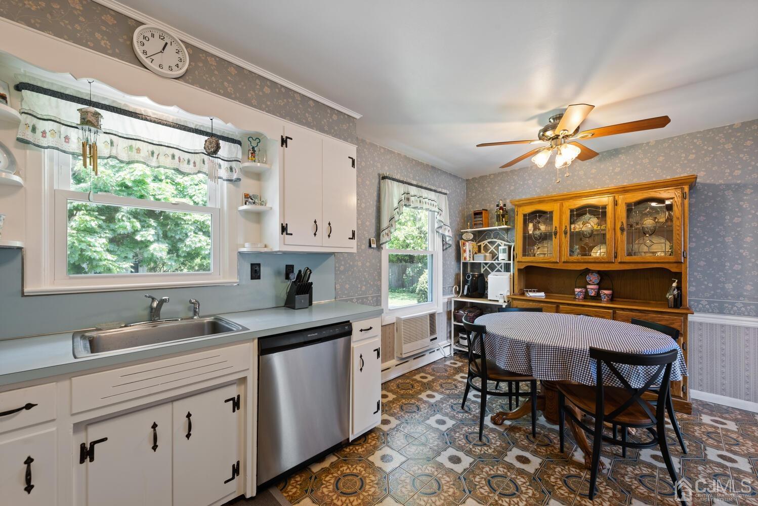 76 Orchard Road Middlesex, NJ 08846 - Photo 11 of 31 a kitchen with a stove a sink a dining table and chairs