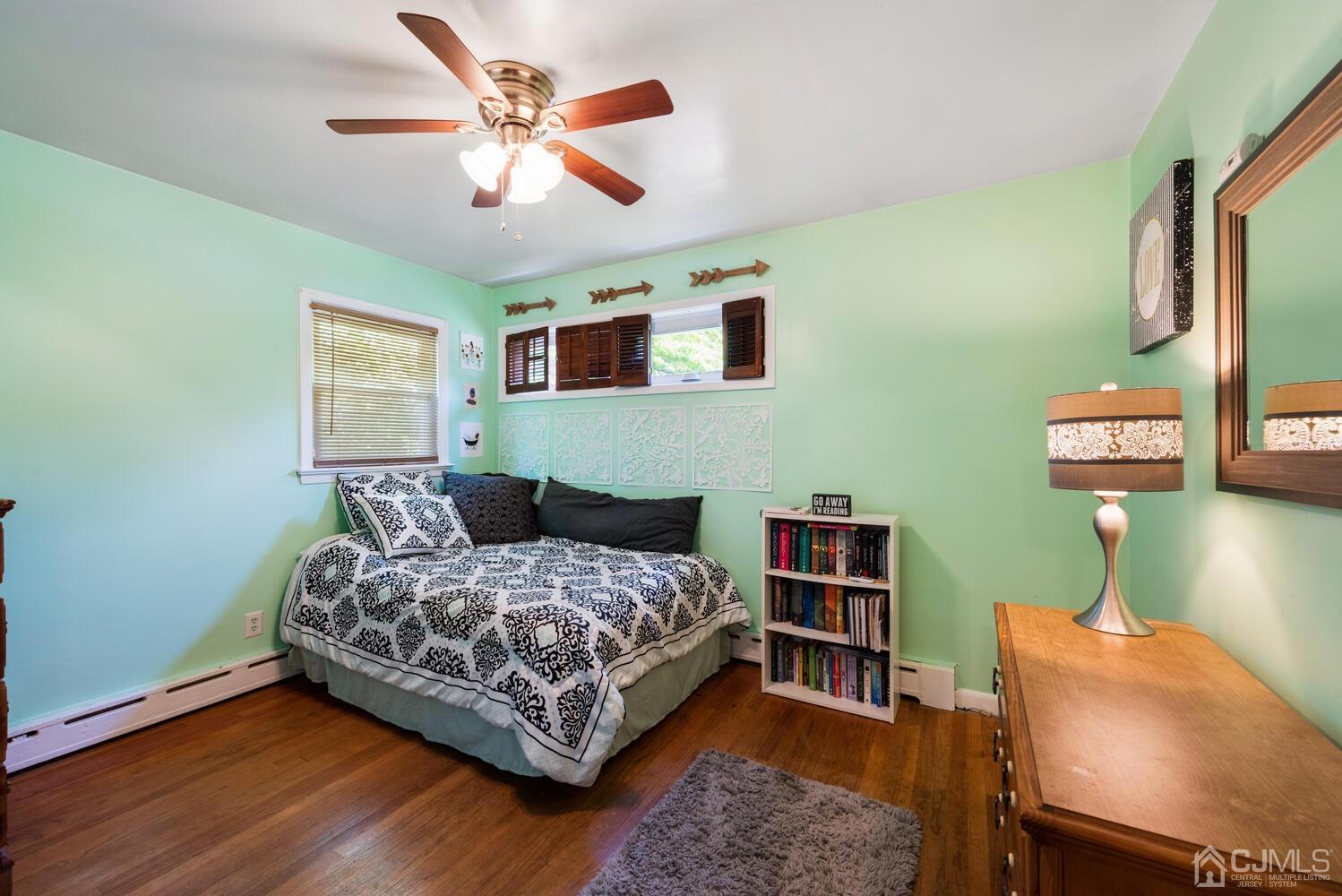 76 Orchard Road Middlesex, NJ 08846 - Photo 16 of 31 a bedroom with a bed and a bookshelf